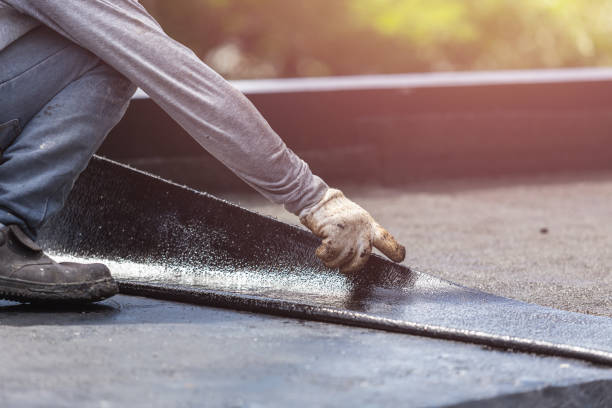 Professional Waterproofing technician working in Linwood, NY